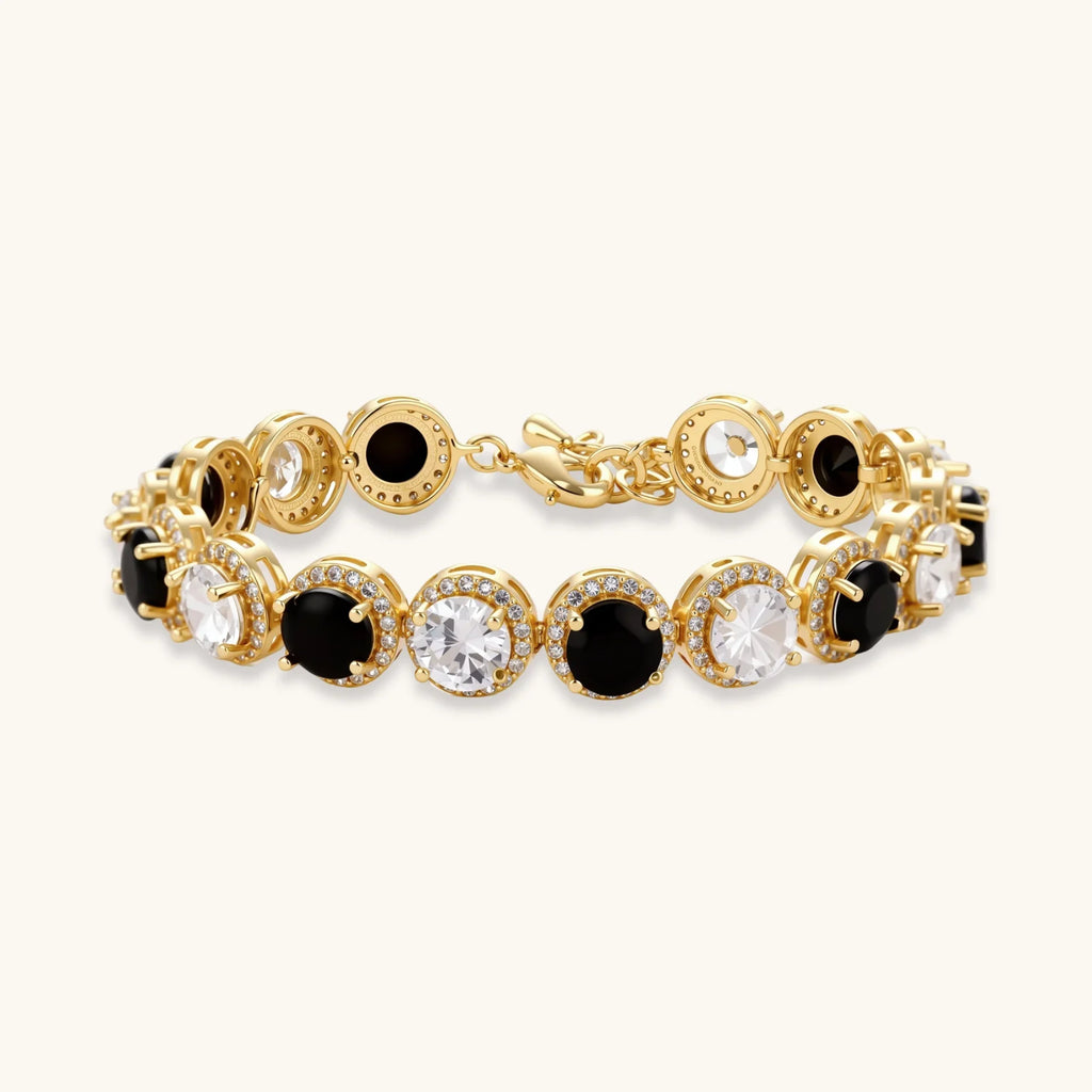 Gold-plated jewelry set with alternating black and clear cubic zirconia stones, featuring necklace, earrings and bracelet