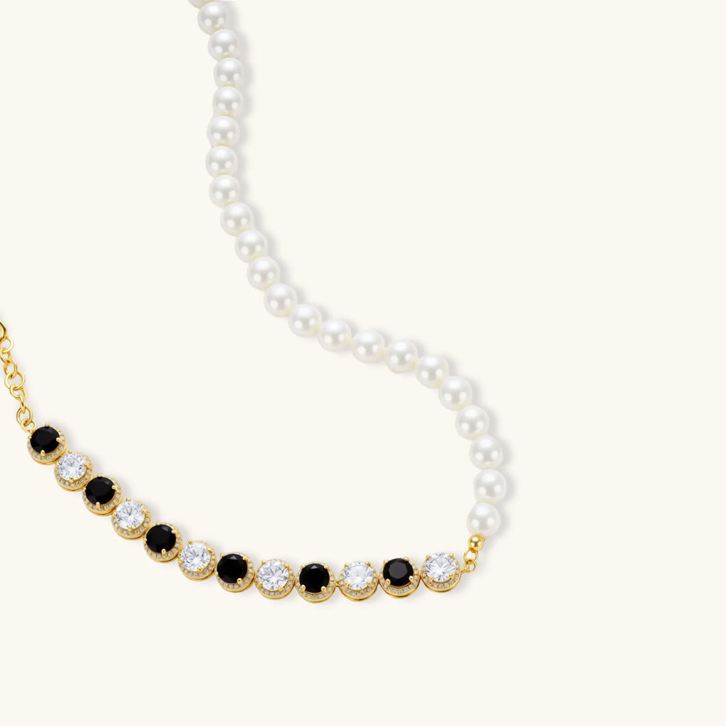 Gold-plated jewelry set with alternating black and clear cubic zirconia stones, featuring necklace, earrings and bracelet