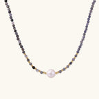 Dainty necklace with faceted purple iolite beads, gold vermeil accents, and central pink-white freshwater pearl.