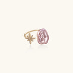 Adjustable gold ring with pink baroque freshwater pearl and crystal-studded star charm on white background